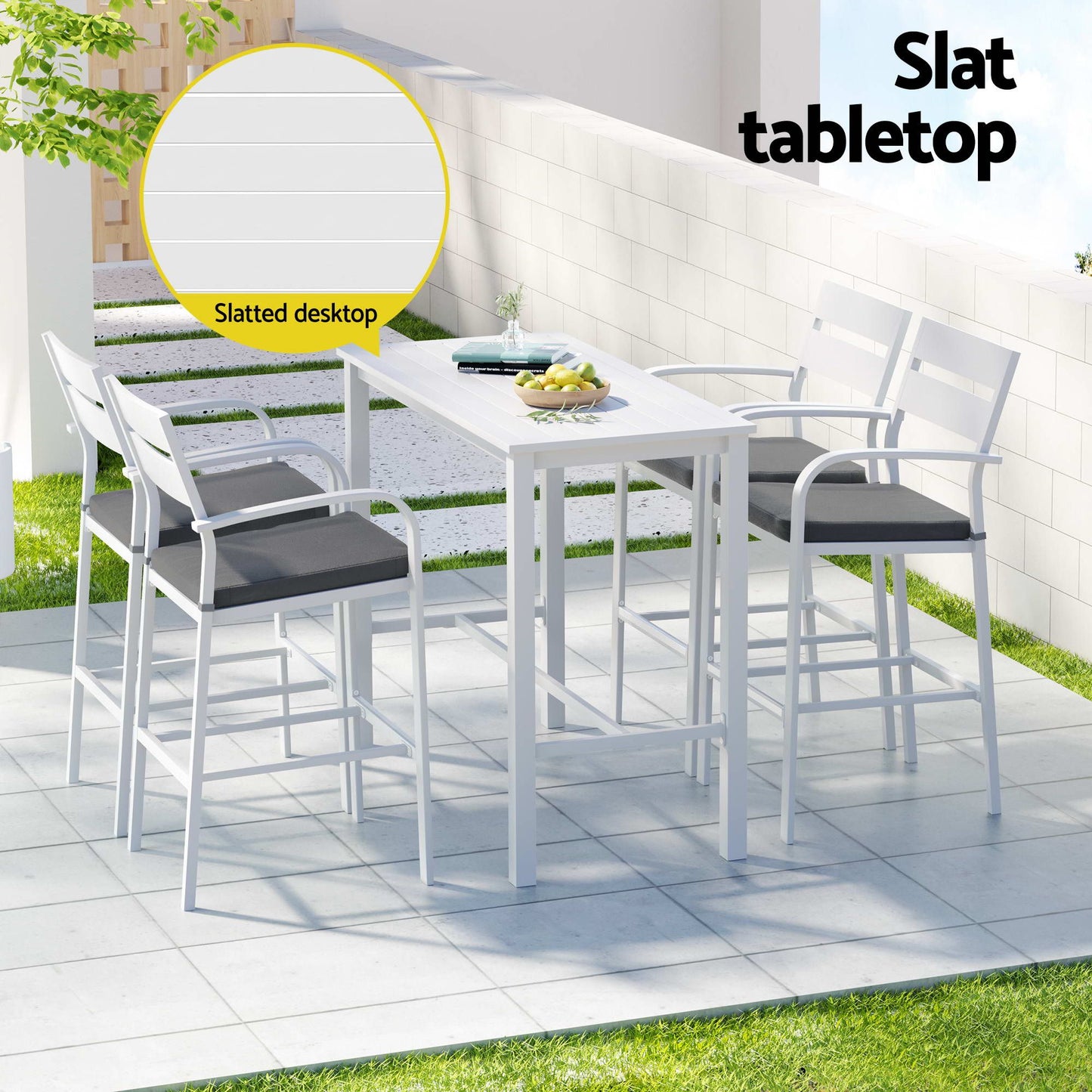 Outdoor dining set with white table and chairs on a patio, featuring a slatted tabletop.