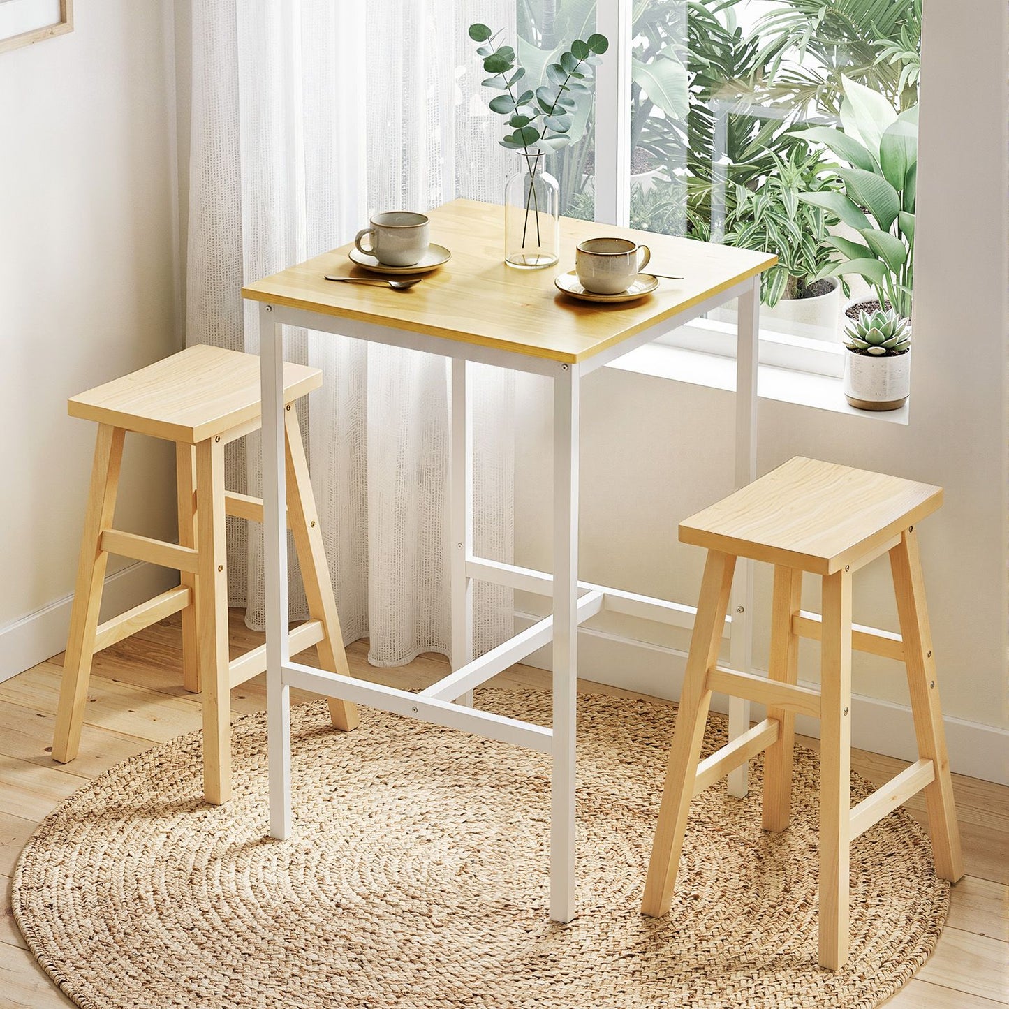 Wooden table with two stools in a bright room with plants