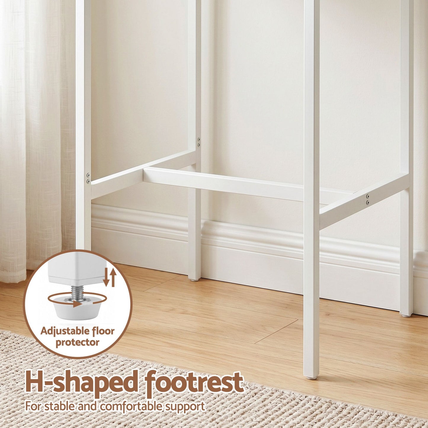 White H-shaped footrest with adjustable floor protector on a wooden floor.