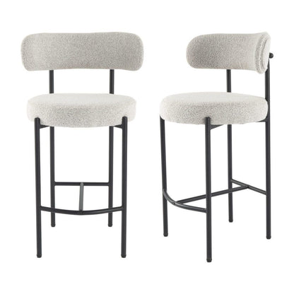 Two bar stools with white cushioned seats and backs on a white background