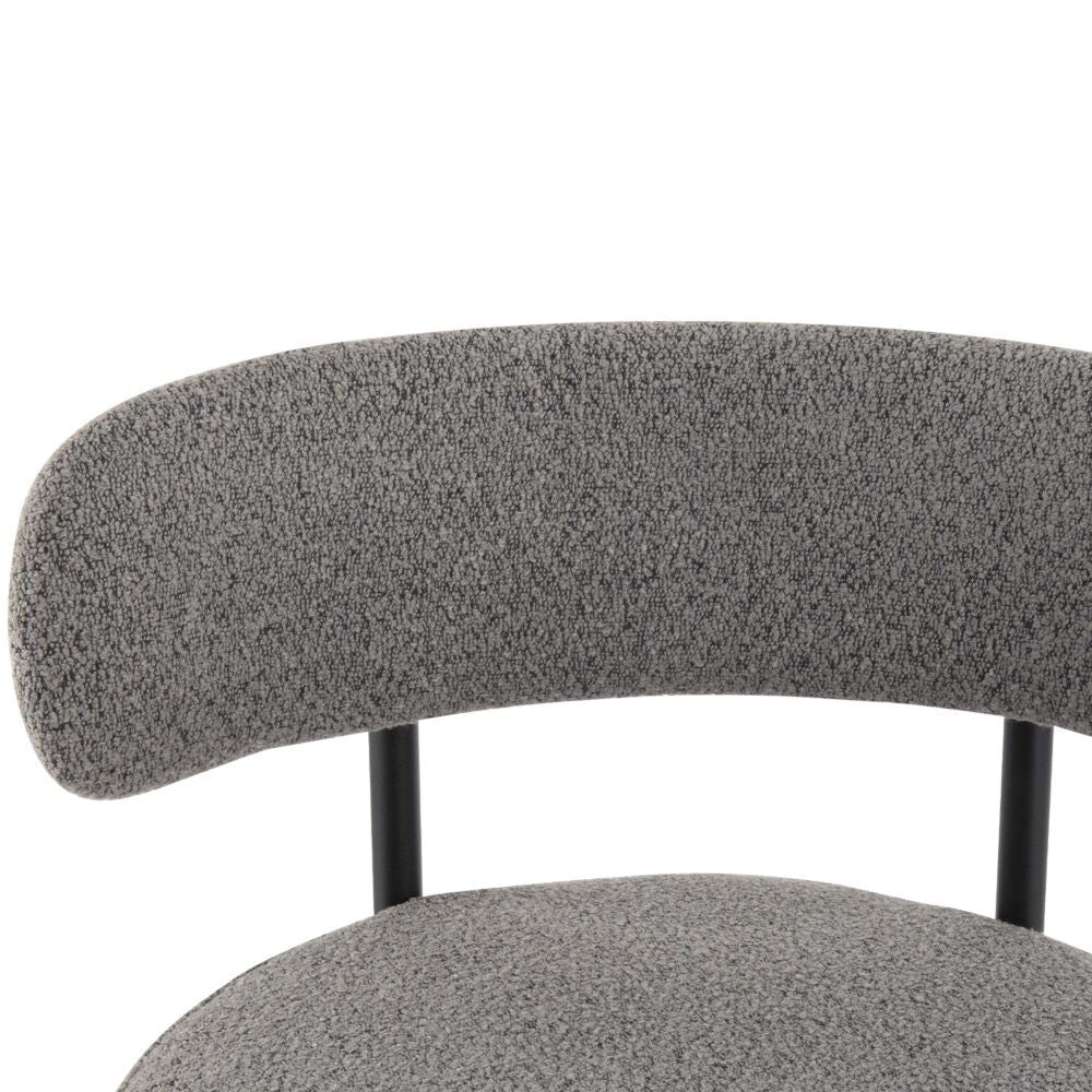 Close-up of a gray upholstered chair with a white background