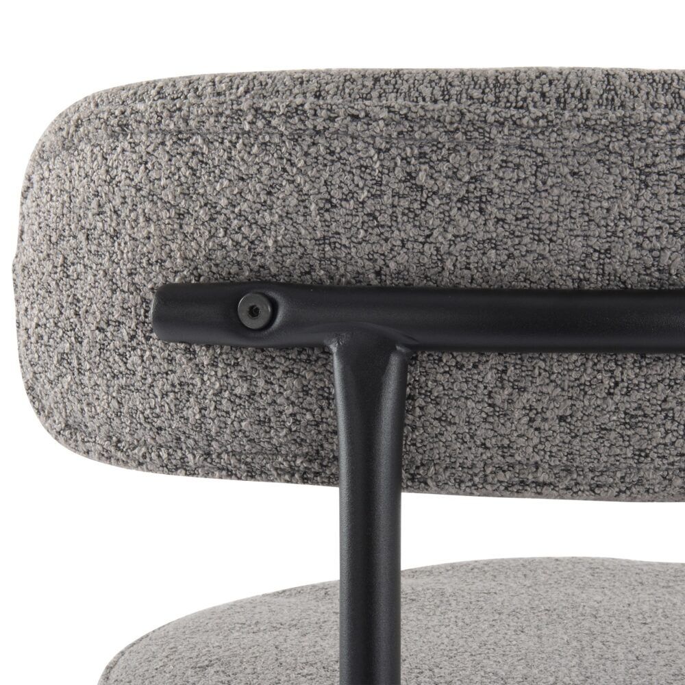 Close-up of a gray textured chair with a black metal base on a white background