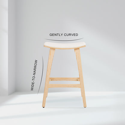 Wooden bar stool with a white cushioned seat on a light gray background