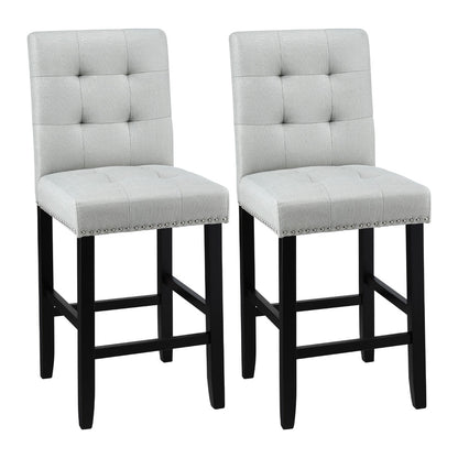 Two grey fabric cushioned bar stools with black legs on a white background