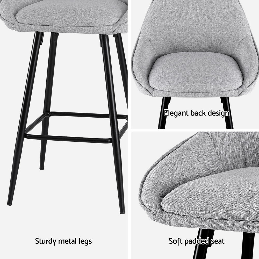 Gray bar stool with sturdier metal legs and soft padded seat on a white background