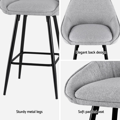 Gray bar stool with sturdier metal legs and soft padded seat on a white background