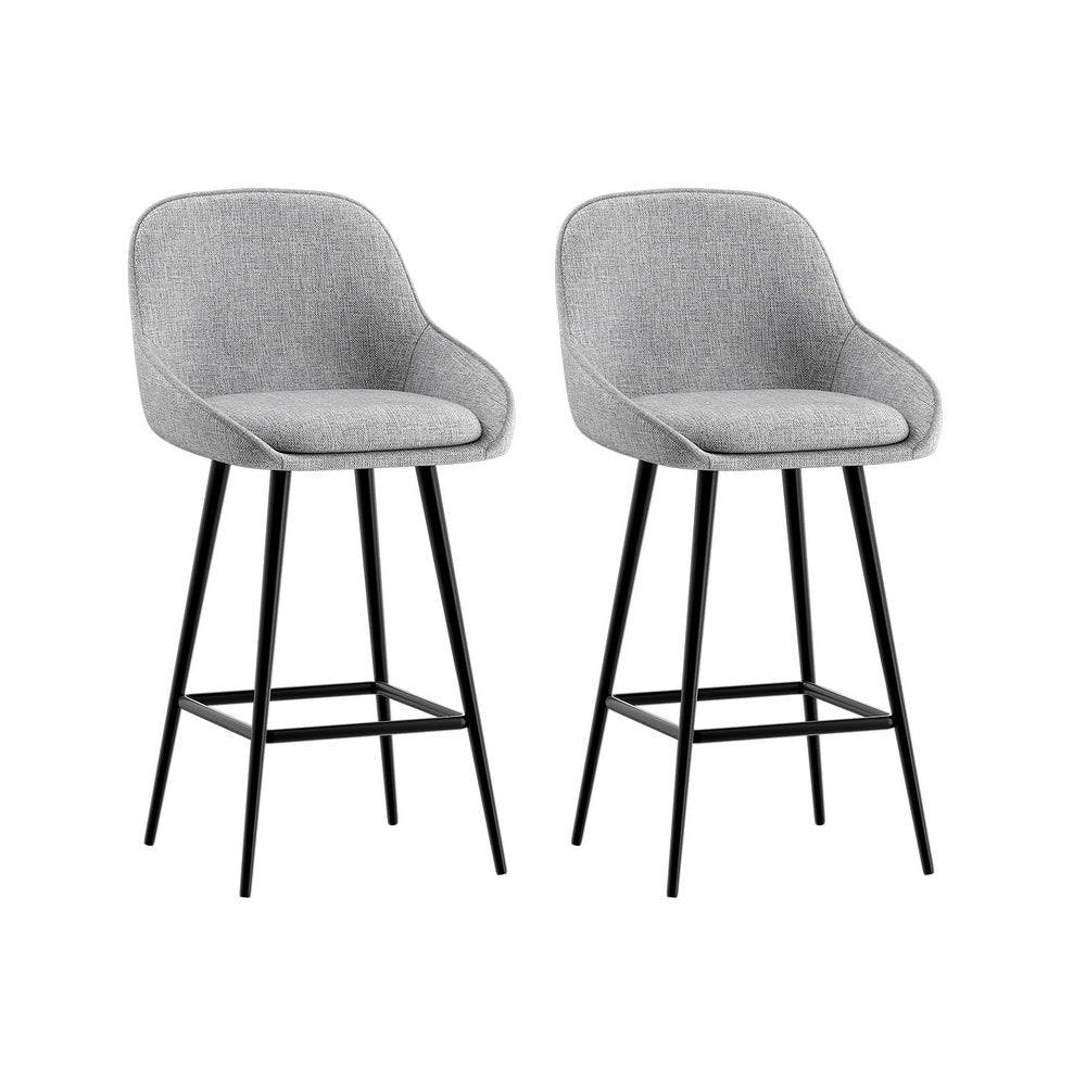 Two gray bar stools with black legs on a white background