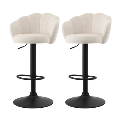 Set of 2 Emma ivory velvet adjustable bar stools with scalloped shell backrests, black pedestal bases and circular footrests.