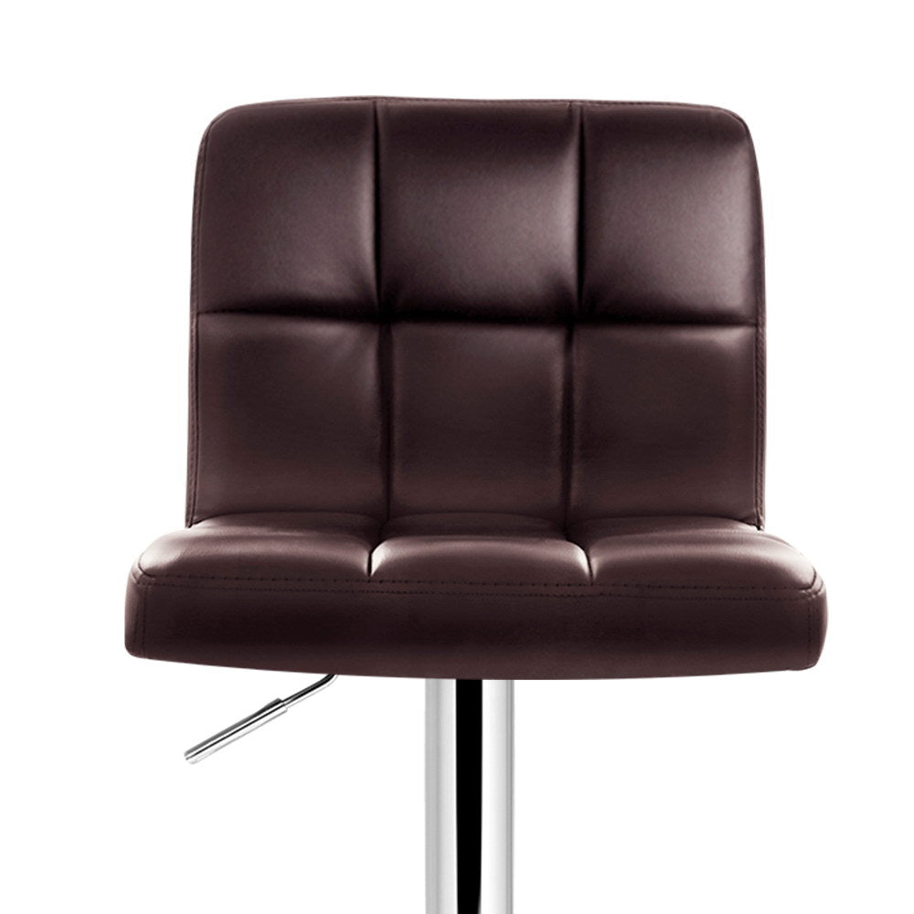 Brown leather indi swivel bar stool seat on a white background