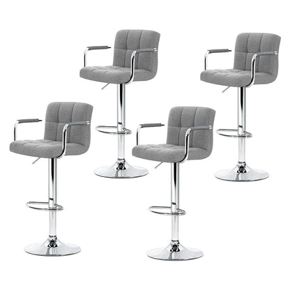 Four gray bar stools with chrome bases on a white background