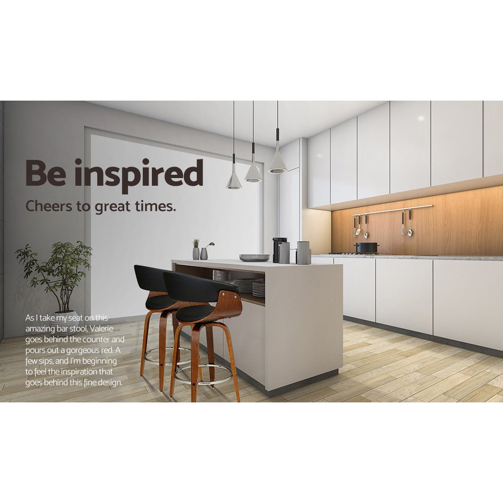 Jasper black PU leather swivel bar stools with walnut-finish timber frames at a modern kitchen island