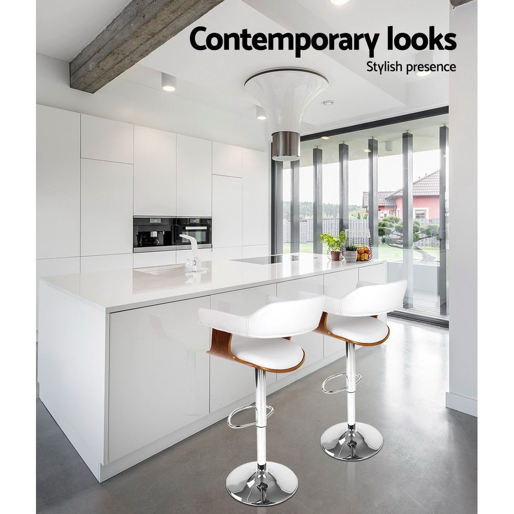 Two white bar stools with wooden seats in a modern kitchen setting, featuring the text 'Contemporary looks' and 'Stylish presence'.