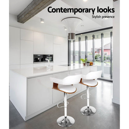 Two white bar stools with wooden seats in a modern kitchen setting, featuring the text 'Contemporary looks' and 'Stylish presence'.