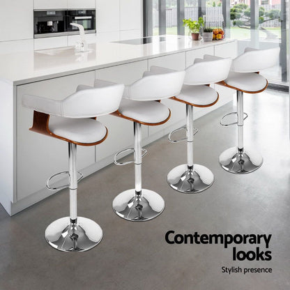 Four white bar stools with wooden seats in a modern kitchen setting, featuring the text 'Contemporary looks' and 'Stylish presence'.
