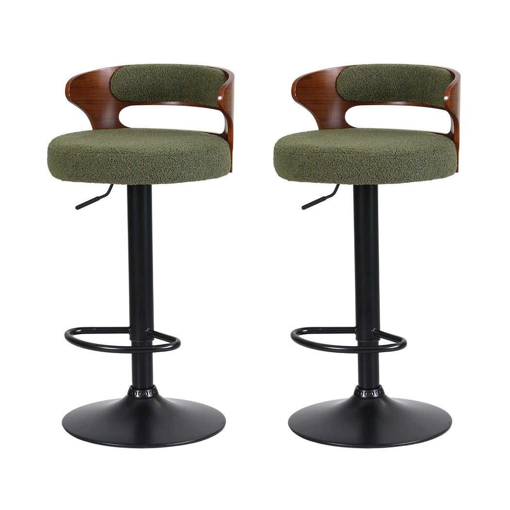 Set of 2 Juna green bouclé adjustable swivel bar stools with curved walnut-look backrests and black pedestal bases on a white background.