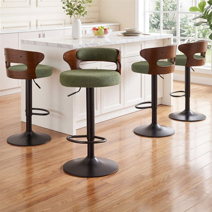 Four Juna green bouclé swivel bar stools with walnut-look backrests positioned beside a white marble kitchen island.