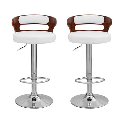 Front view of two Juna white pu leather adjustable swivel bar stools with curved walnut-look backrests and chrome bases.