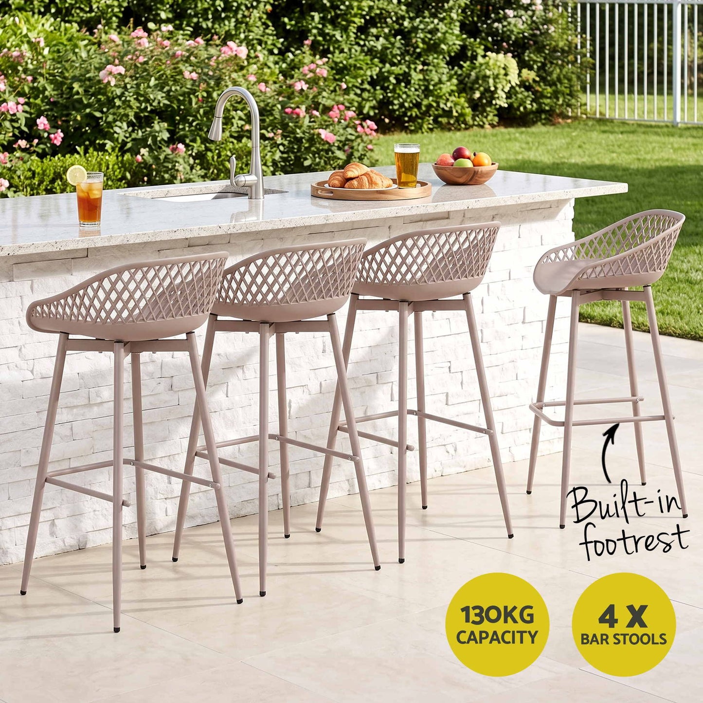 Set of four beige Kian outdoor bar stools at a stone outdoor kitchen, with 130kg weight capacity.