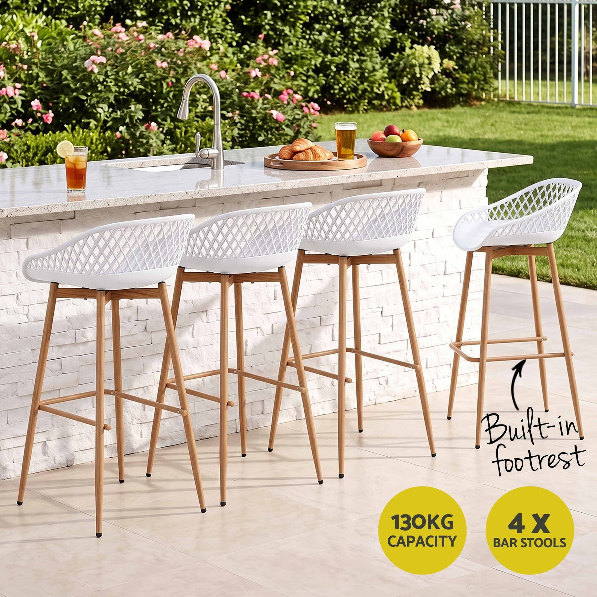 Set of four white Kian outdoor bar stools at a stone outdoor kitchen, with 130kg weight capacity.