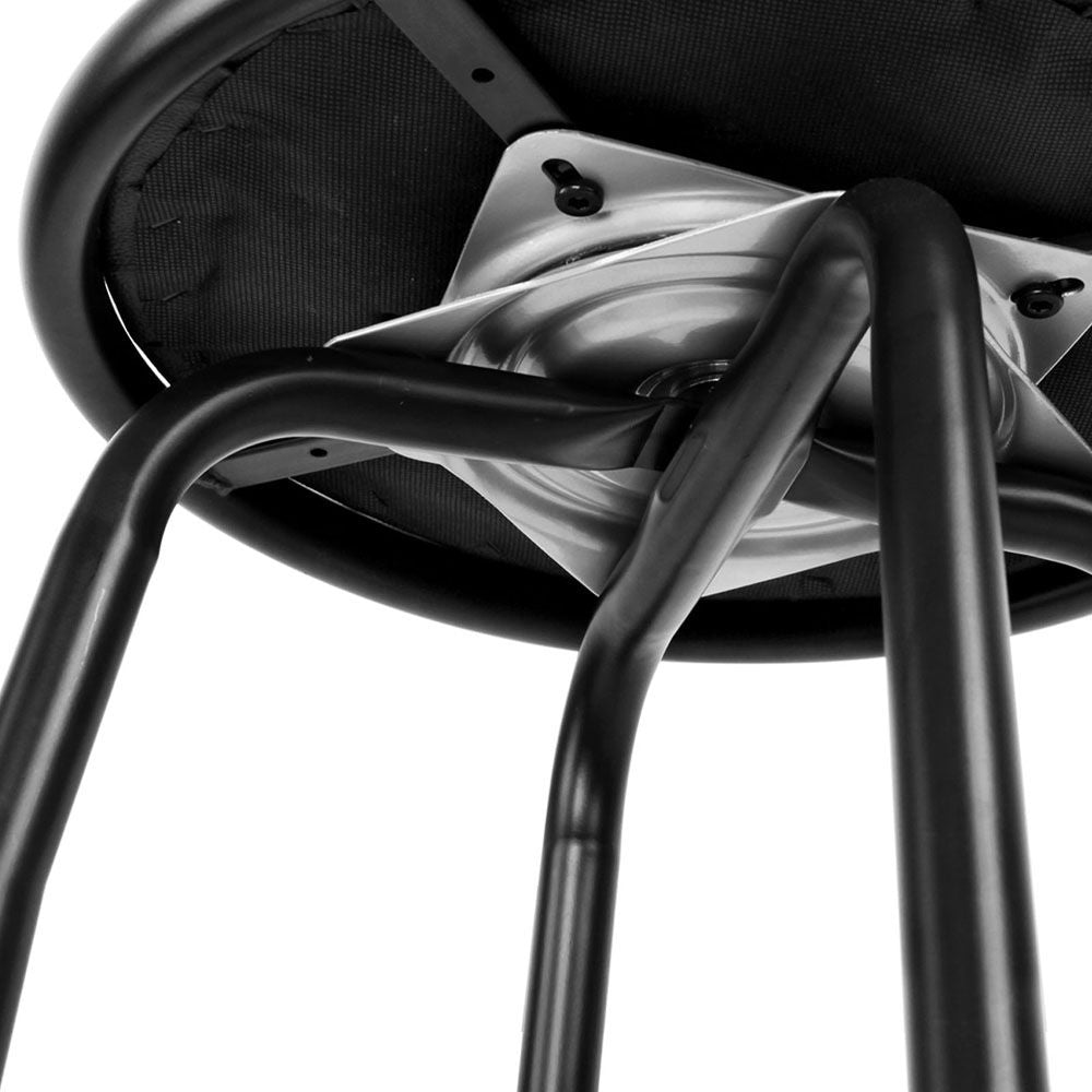 Close-up of a black chair with a white cushion on a white background