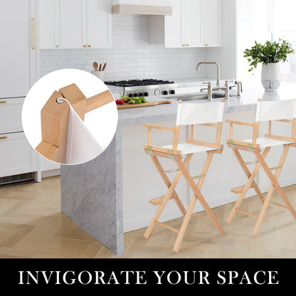Modern kitchen with light cabinets and a pair of Oxford beechwood tall director chairs around an island bench