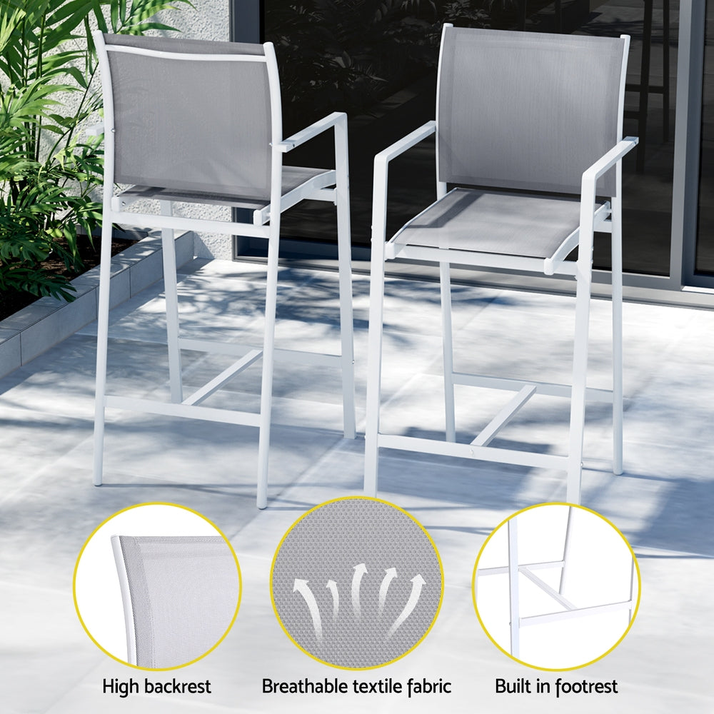 Two outdoor chairs with grey cushions on a patio, featuring high backrest, breathable textile fabric, and built-in footrest.