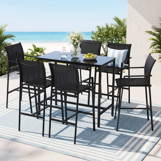 Outdoor patio set with high table and chairs on a deck with ocean view