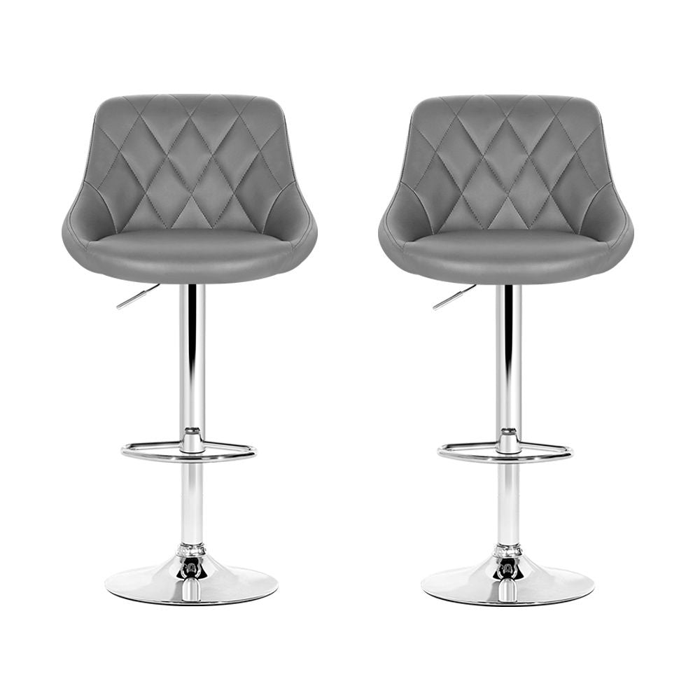 Two grey quilted bar stools with chrome bases on a white background