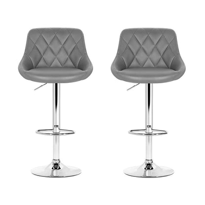Two grey quilted bar stools with chrome bases on a white background