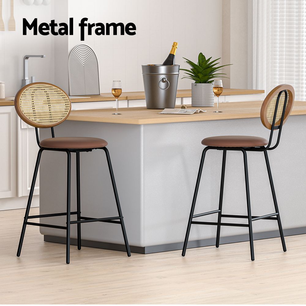 Two bar stools with metal frames in a modern kitchen setting.