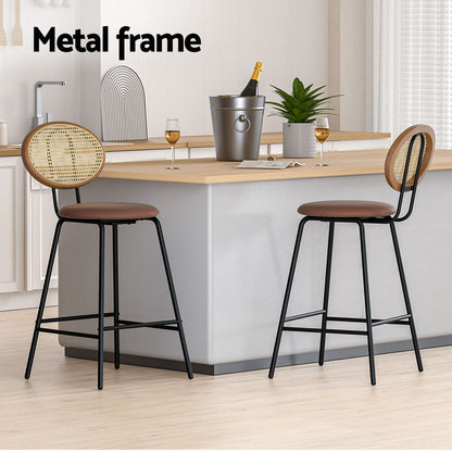 Two bar stools with metal frames in a modern kitchen setting.