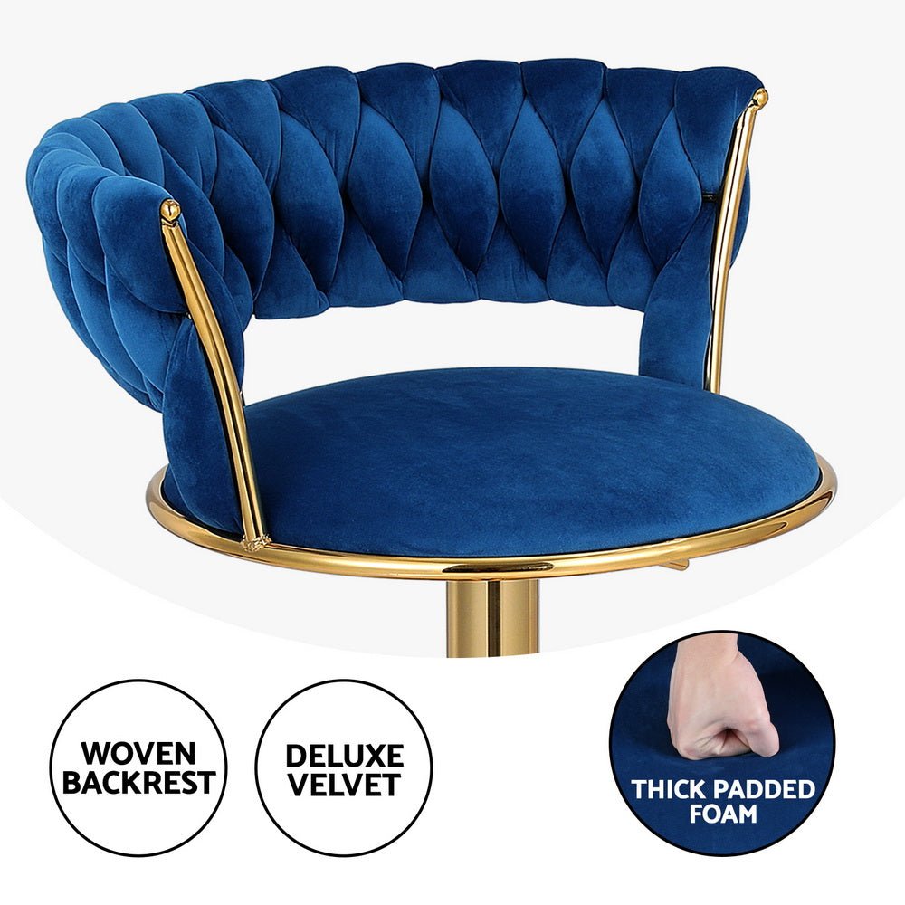 Sola navy blue velvet bar stool with deep tufted backrest, thick padded seat and gold-tone frame.