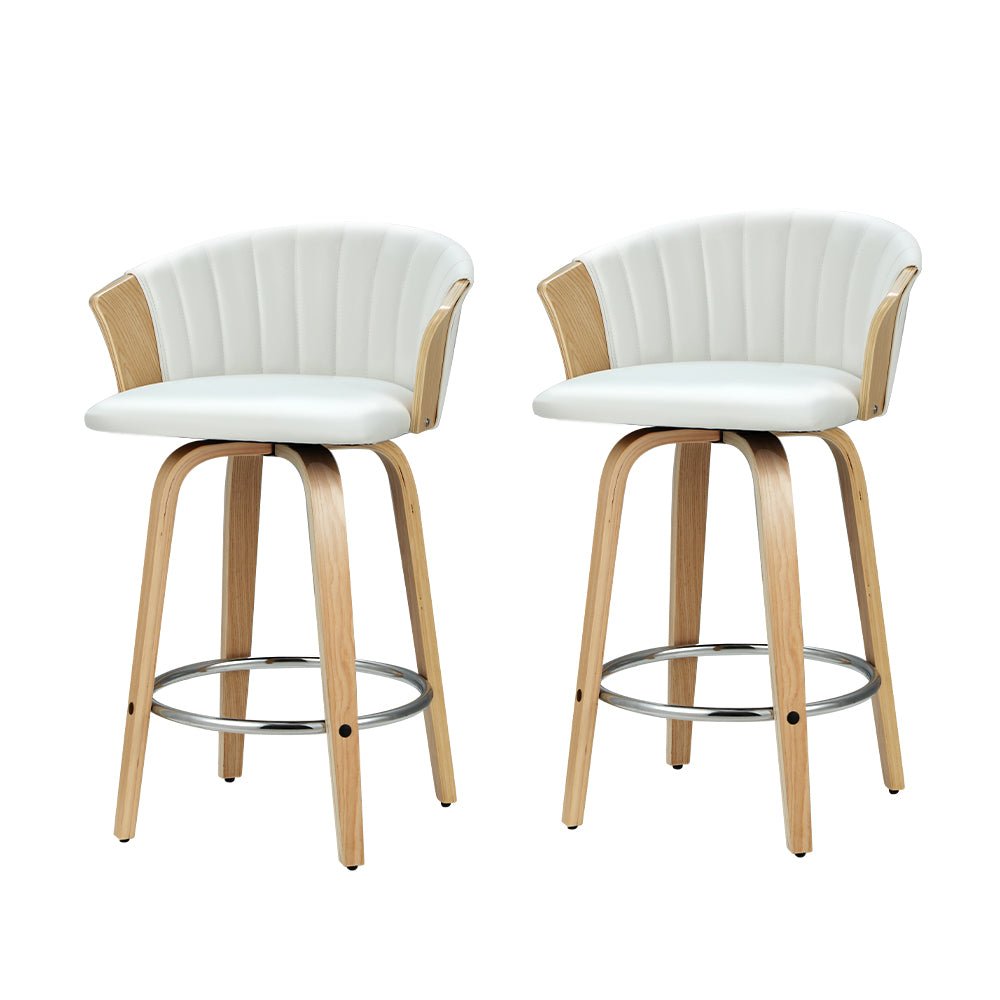 Two white bar stools with wooden legs on a white background