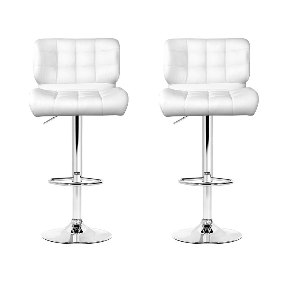 Two white bar stools with quilted design on a white background