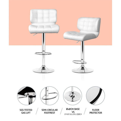 Two white bar stools with features highlighted on a pink background